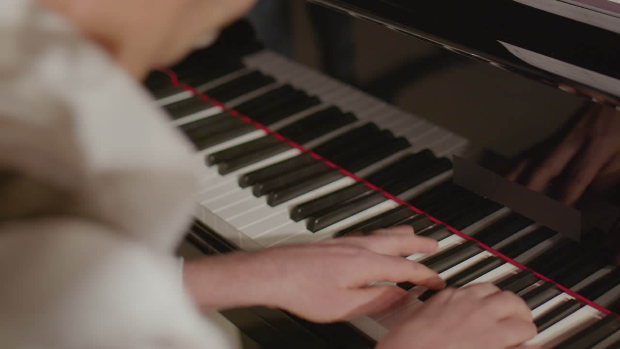 Close Up of Musician Playing Grand Piano