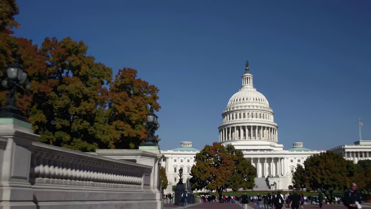 Wide-angle video shot of the U.S. Capitol building, showcasing its grandeur with a clear blue sky
