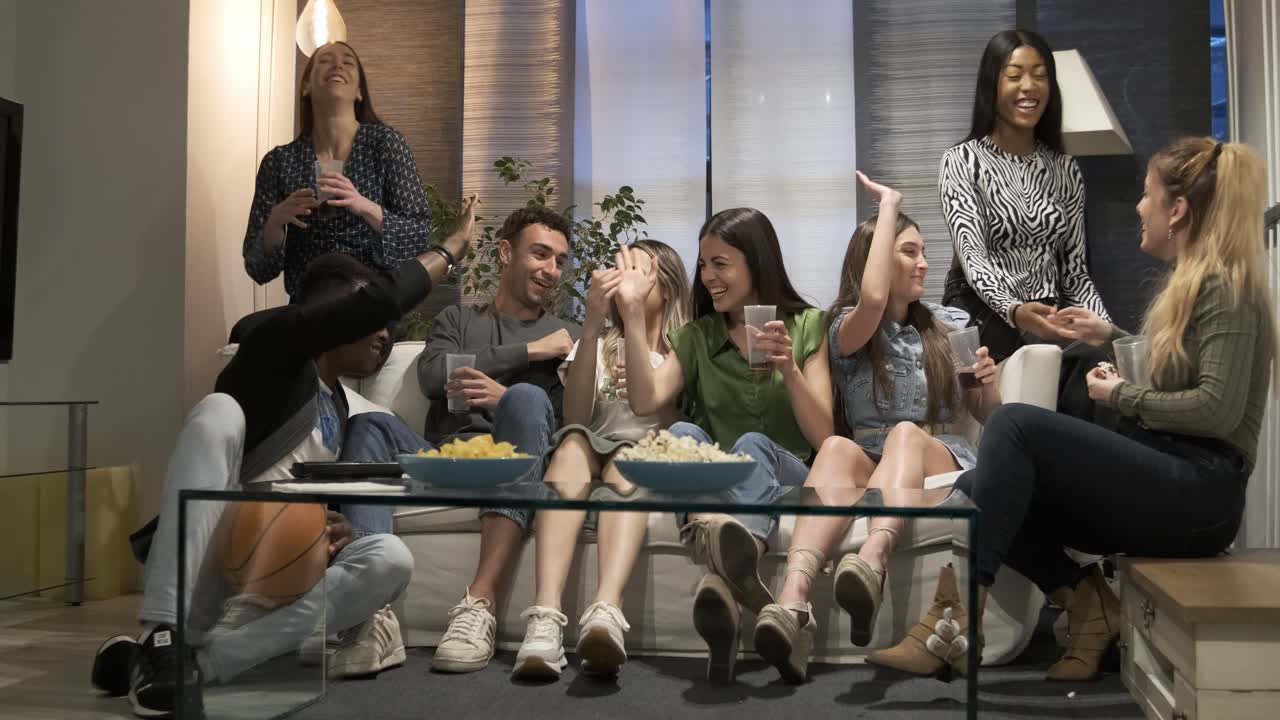 Friends watching a movie/sports game