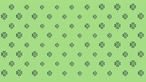 Digital-animation-of-multiple-clover-leaves-moving-against-green-background