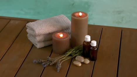 beauty treatments and candles poolside