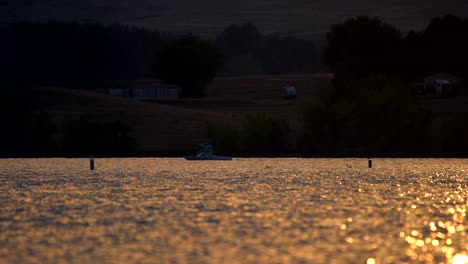 water sports activities in boulder reservoir during sunset