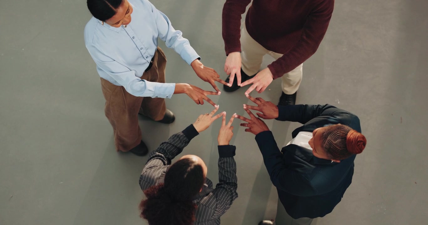 Diverse Business Team Forming a Star Shape with Fingers