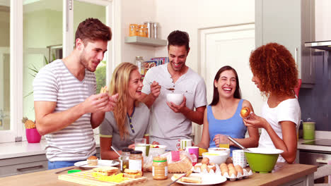 Friends-talking-while-eating-breakfast-together