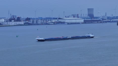 a merchant ship with containers floating on the river at olesia moerdijk in holland