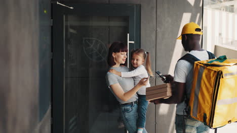 family receiving food delivery