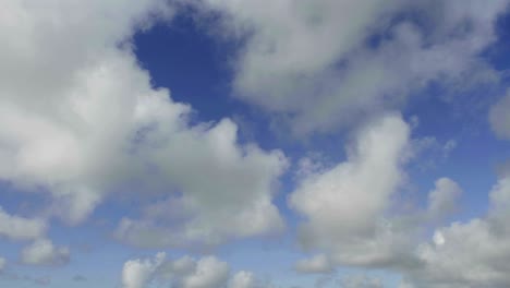 time lapse of clouds against blue sky moving forward 1