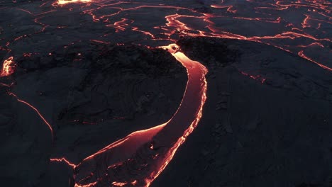 red lava flow during geldingadalur eruption in iceland - aerial drone shot