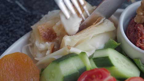 turkish breakfast with pastry, cheese, tomato, cucumber, and apricot