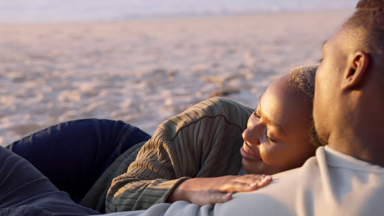 Father and Daughter Relaxing at the Beach Sunset