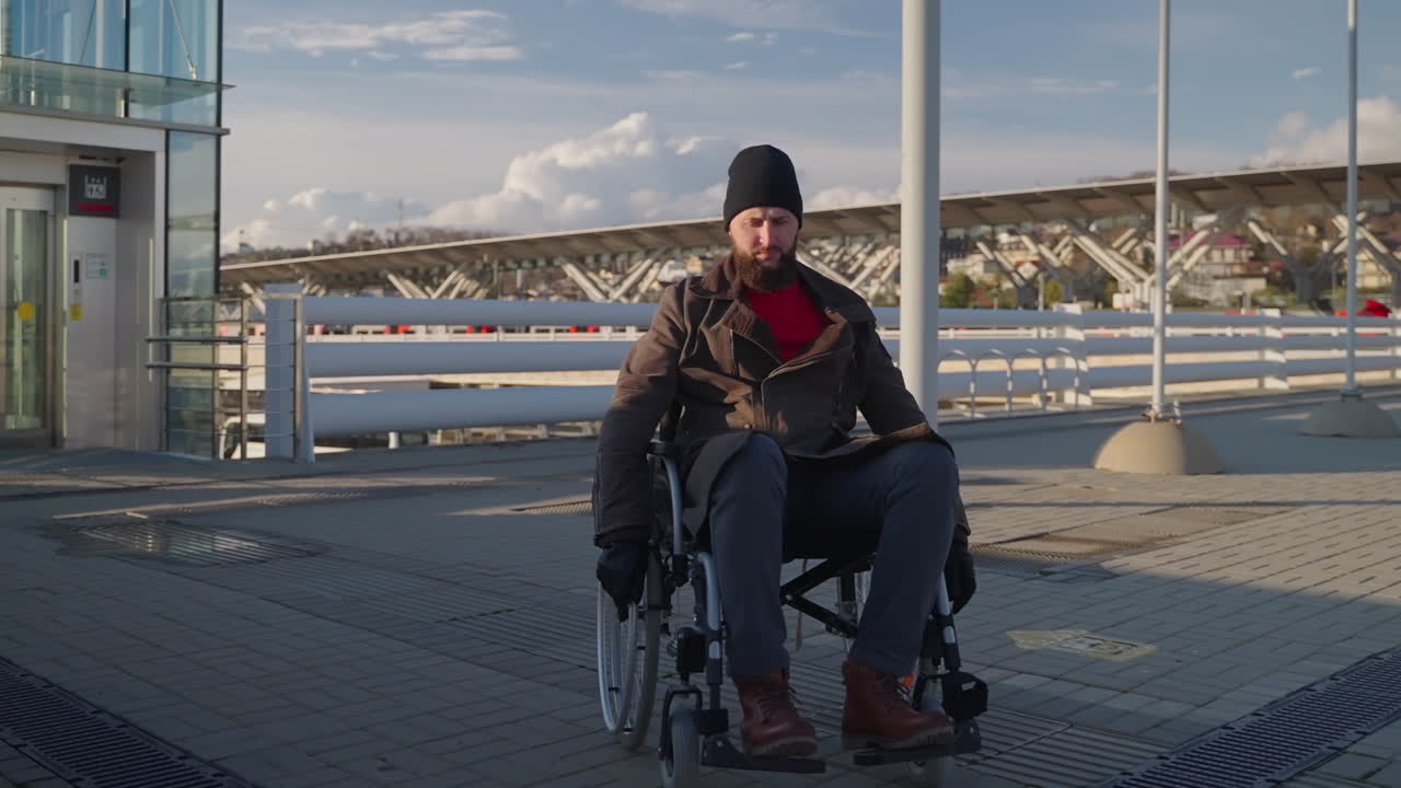 Man in Wheelchair at Transportation Hub