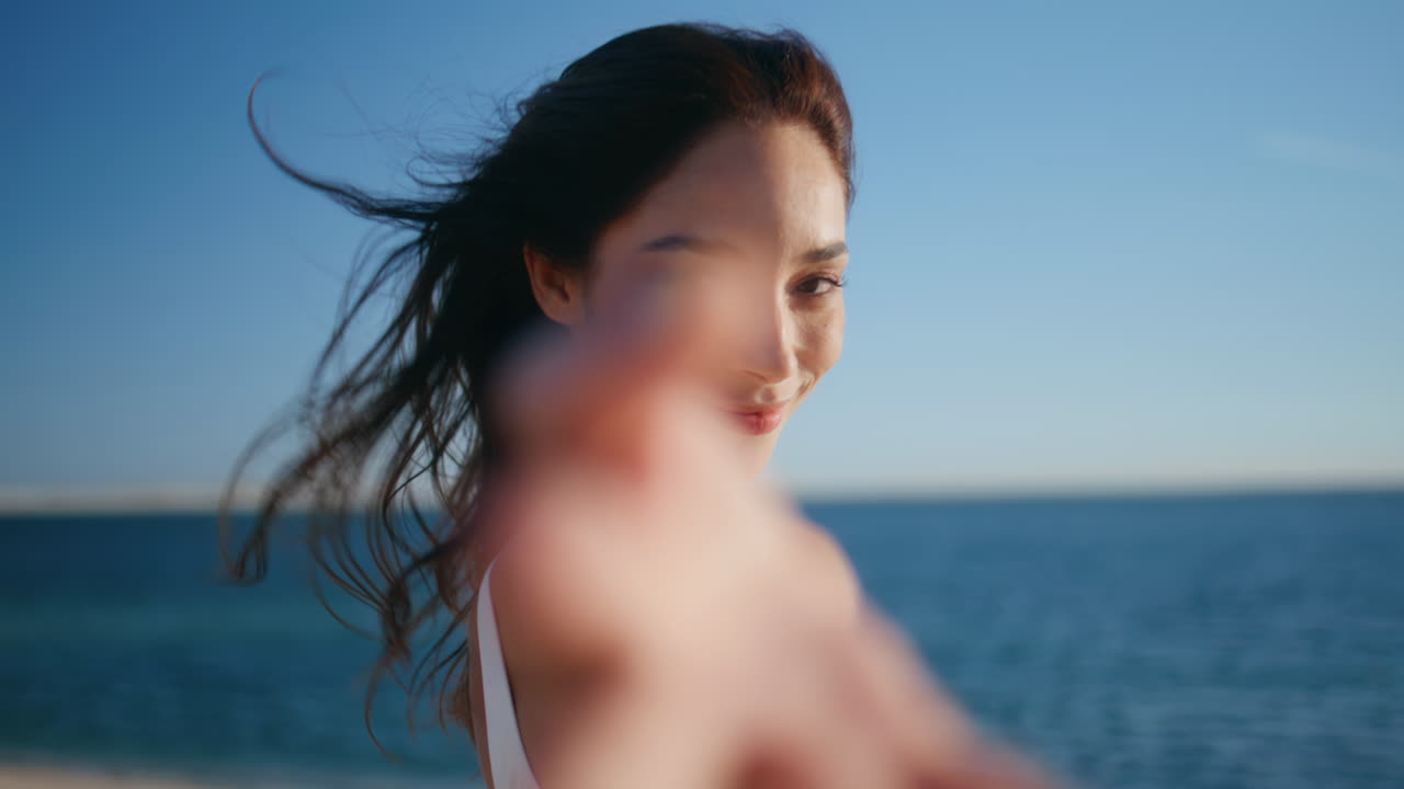 Carefree tourist strolling coastline relaxing under summer sunlight closeup