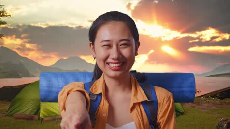 happy woman on a camping trip pointing at viewer
