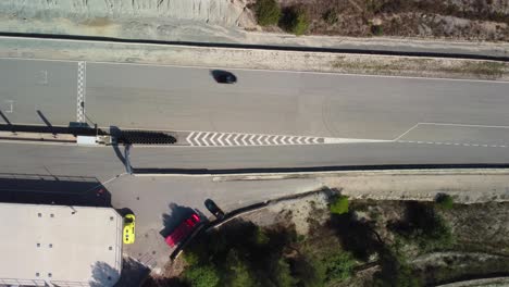 Castelloli-speed-circuit-in-barcelona-with-cars-on-the-track,-aerial-view