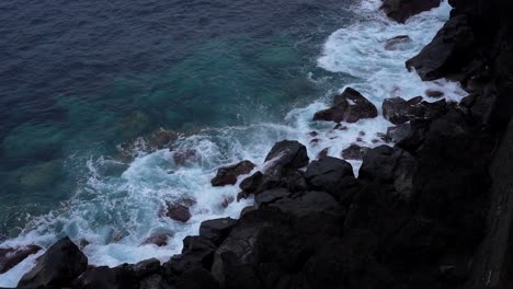 dramatic footage of waves crashing into the volcanic rocks of terceira, azores