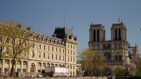 wide angle view of notre dame catedral under summer vibes during daylight.