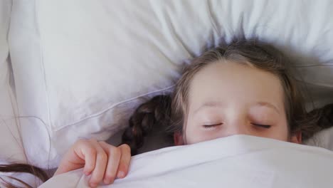 Girl-sleeping-peacefully-with-blanket-covered-on-face-4k