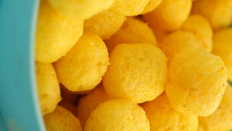 close-up of puff balls snacks in a bowl
