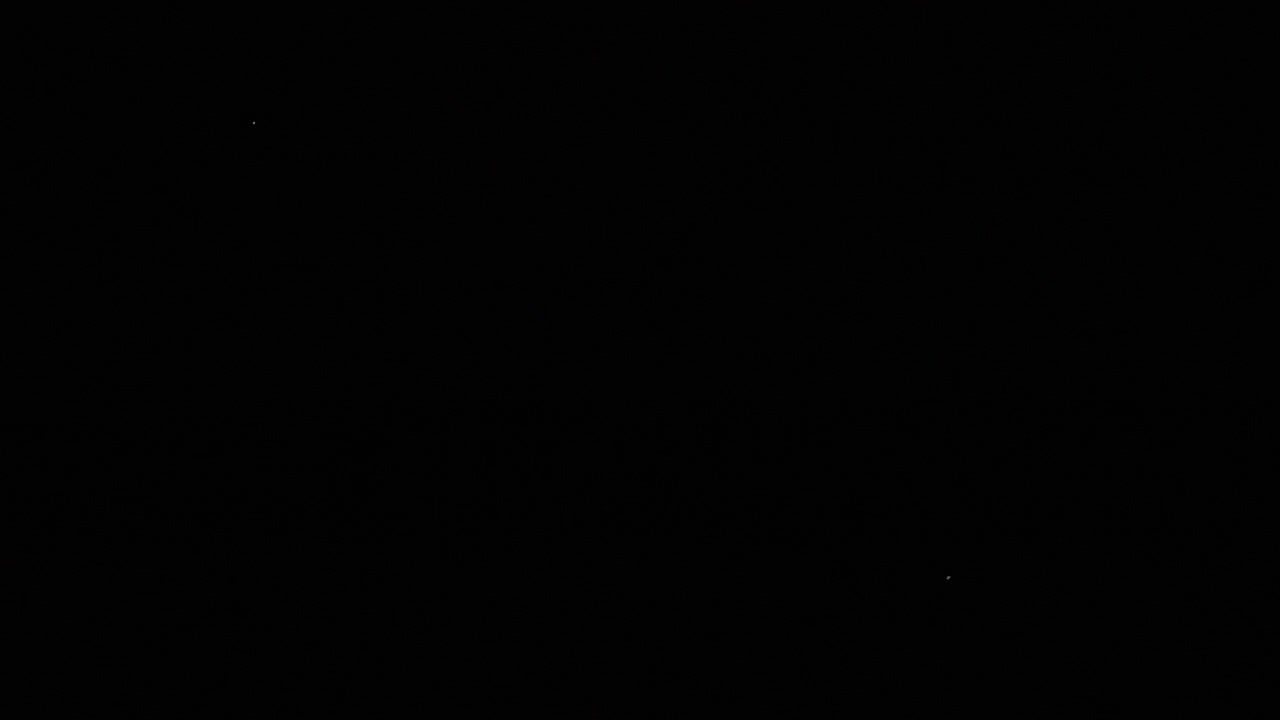 Faint Distant Lights Flickering in Total Darkness