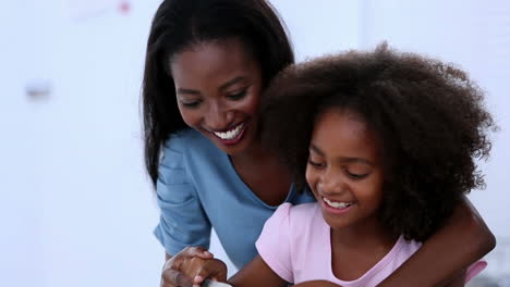 Mother-and-daughter-preparing-vegetables-