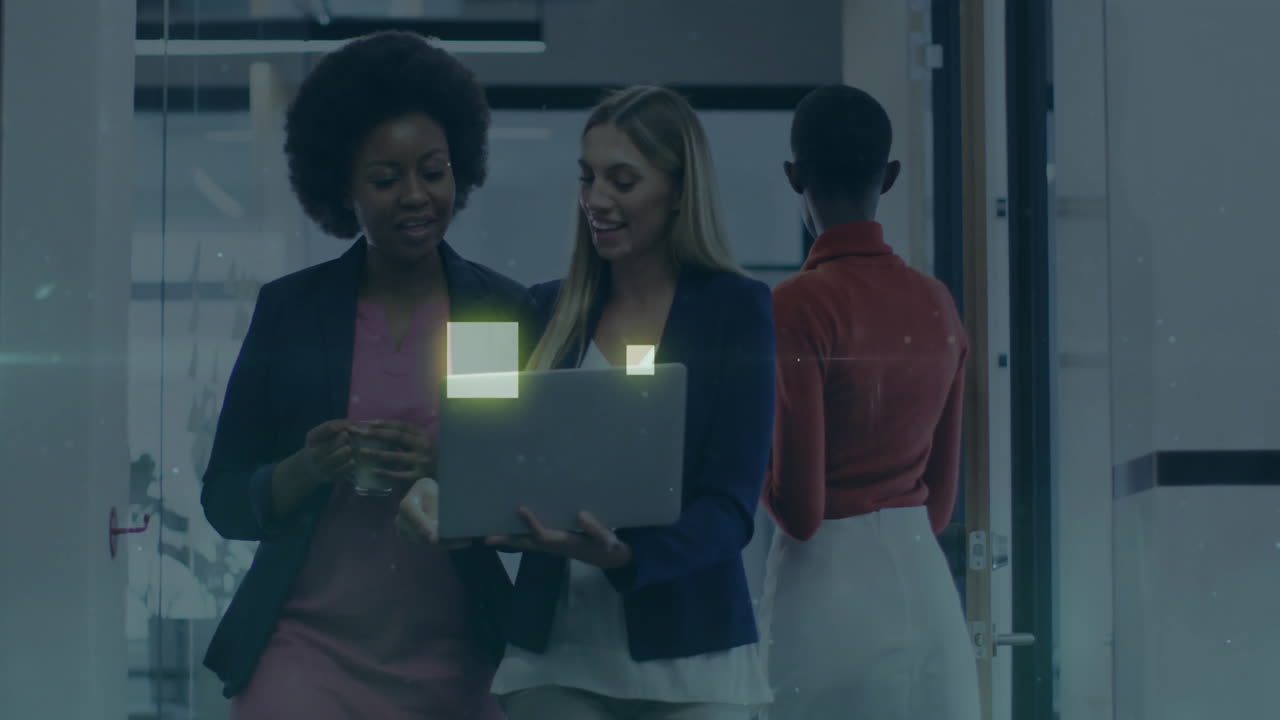 Discussing business strategy, businesswomen using laptop with digital data overlay