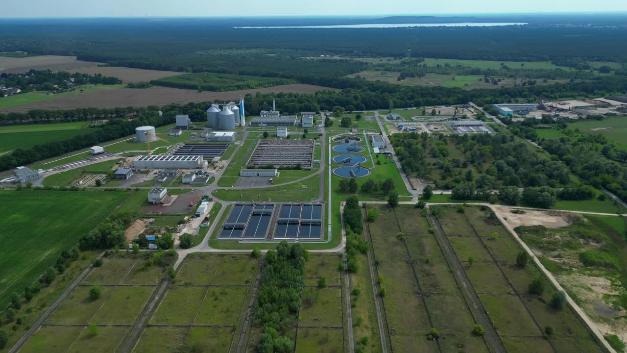 Wastewater treatment plant aerial view, demonstrating water purification process, ensuring environmental sustainability and resource management. Nice aerial view flight fly push forward drone
