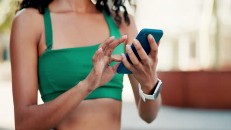 woman using phone while working out