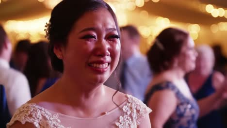emotional bride celebrating joyful moments surrounded by loved ones, capturing the depths of happiness and sentiment on a wonderful occasion