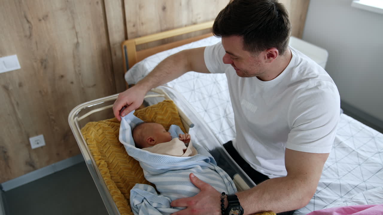 Father Caring for Newborn Baby