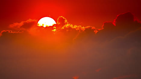 sunset timelapse, bright sun globe hiding behind clouds. warm orange sky