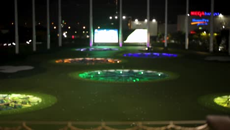 illuminated golf range with vibrant target lights