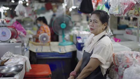 woman working at a market stall