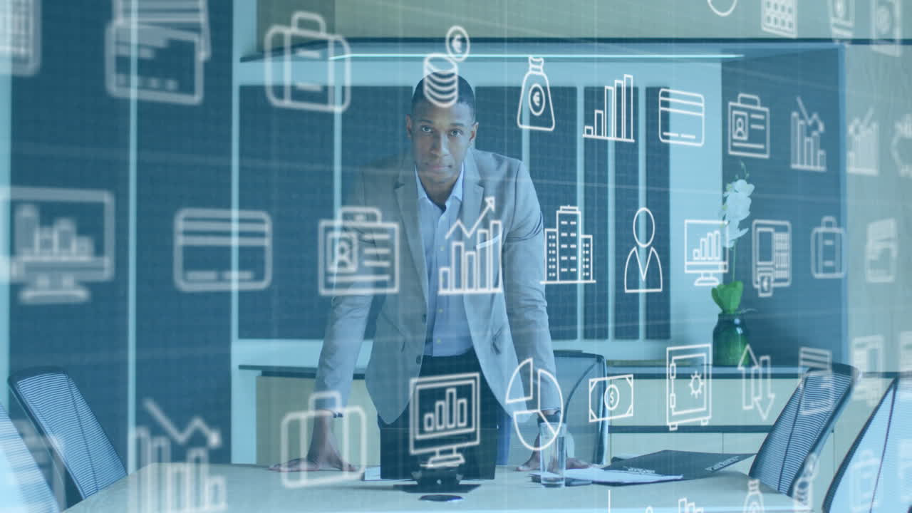 Businessman in office with data analytics and business icons animation over him