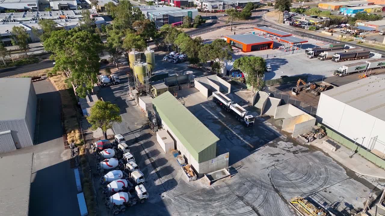 Drone flying over an industrial area during noon.