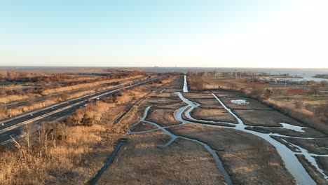 An-aerial-view-over-a-marsh-on-Long-Island,-NY