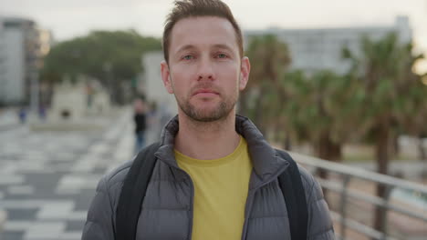 portrait young caucasian man looking serious pensive male tourist enjoying vacation in urban city at sunset