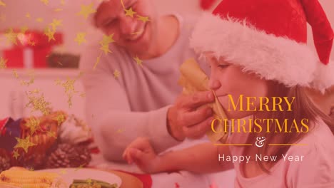 animation of christmas greetings text over caucasian father and daughter at christmas dinner