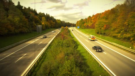 Fast-driving-cars-at-a-freeway-with-a-sepia,-old-looking-video-effect