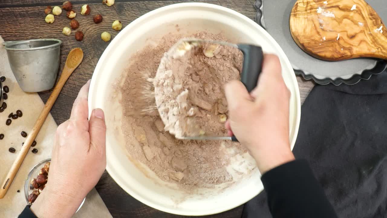 A delicious dessert, Coffee Hazelnut Cream Tart. Made with espresso powder, chocolate crust and loaded with crushed hazelnut. Making a chocolate pie crust and mixing in the cold butter