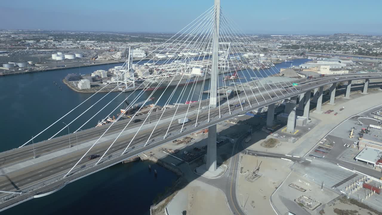 Industrial 4K drone shot flying slowly past cars on a bridge in Long Beach. Slow motion capable, ideal for commercials, city, urban, or cinematic projects
