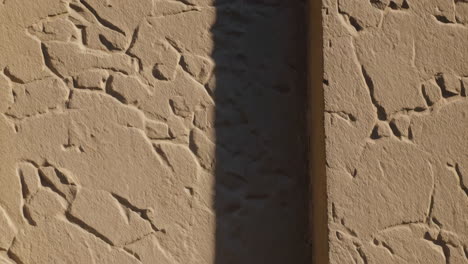 beige stone wall with shadow