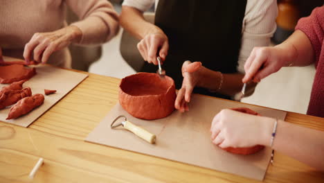 women in a pottery class