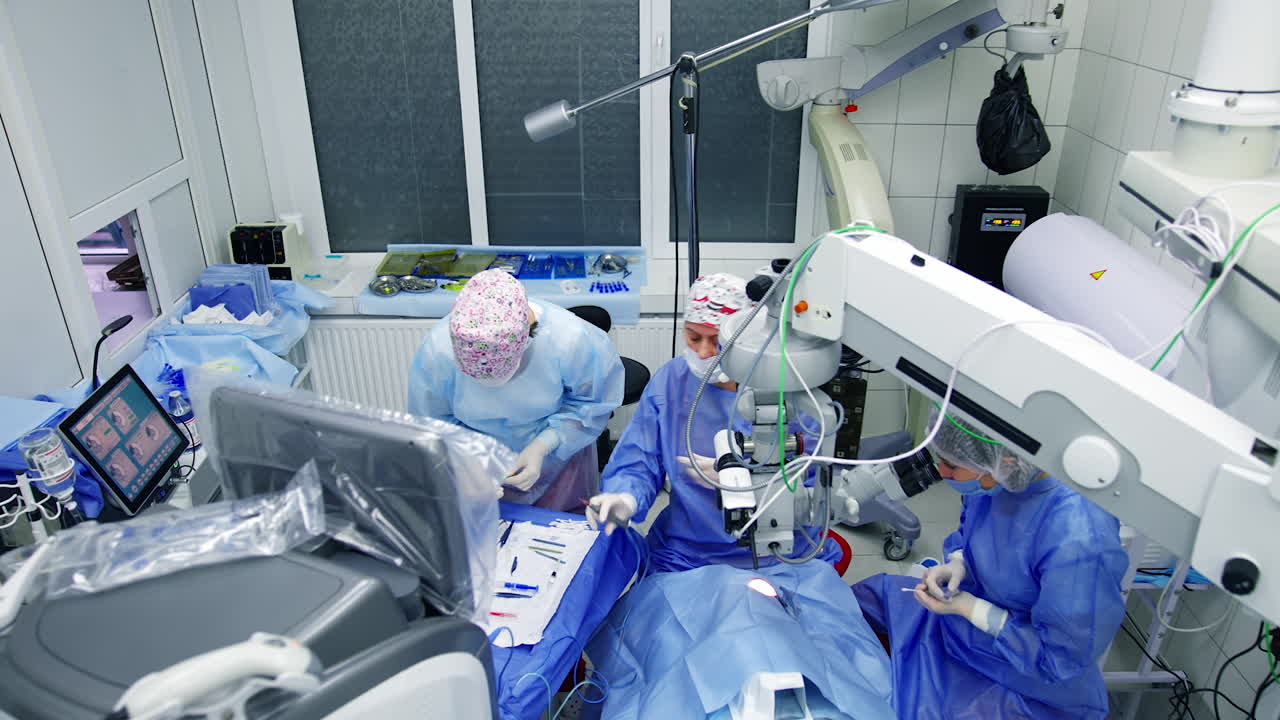 View of cataract surgery. Team of medical workers performing eye surgery
