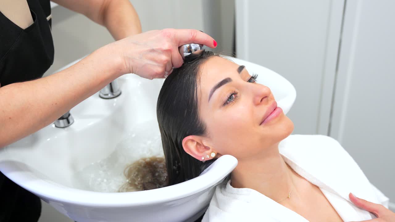 Woman Getting Hair Washed at a Salon