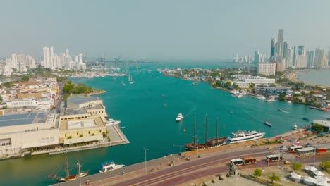 Aerial-drone-shot-of-Cartagena-city-in-Colombia,-the-ocean-and-the-buildings