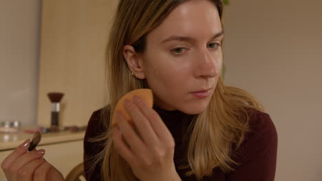 Girl-doing-makeup-on-herself-at-home