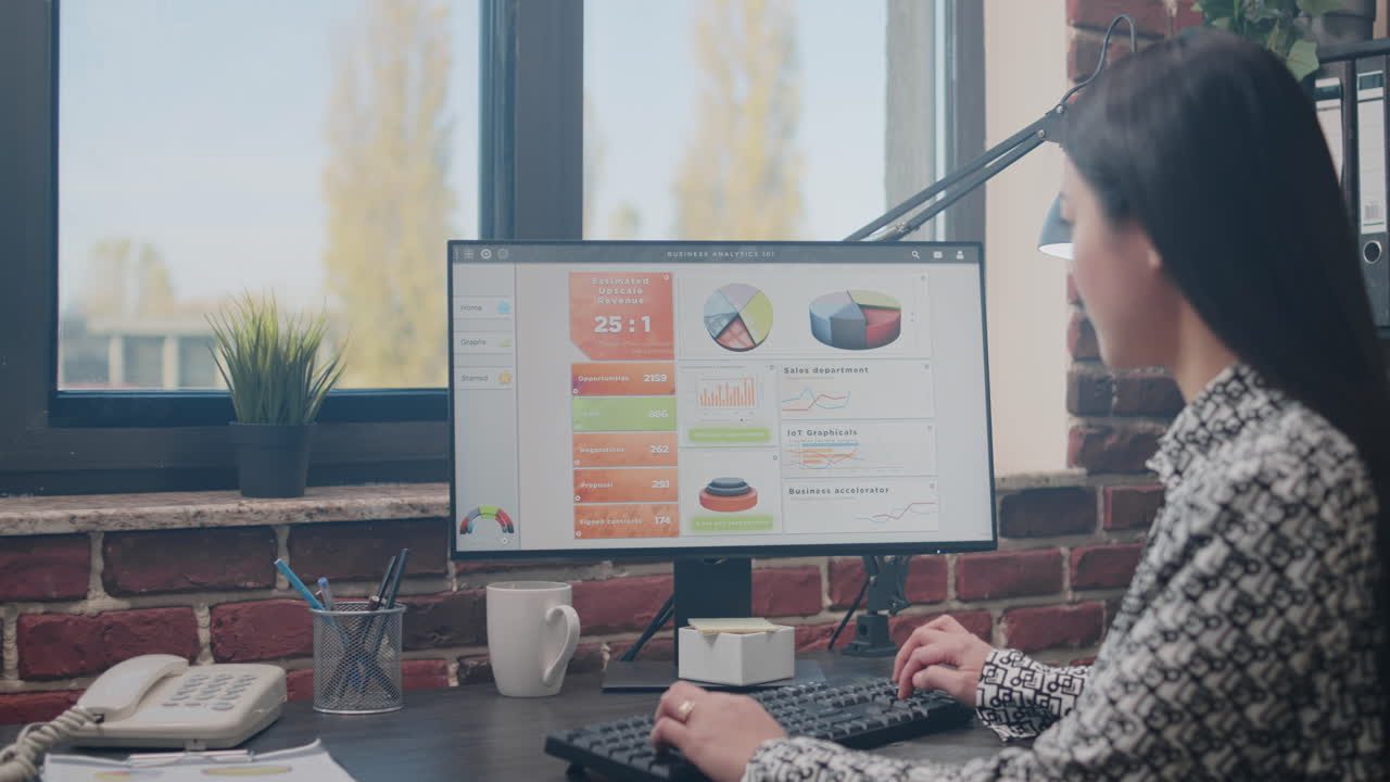 Entrepreneur working with business charts on computer