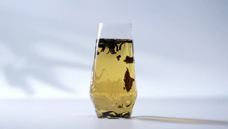 refreshing steaming glass cup of tranquil green elegant tea ceremony: aromatic herbal infusion