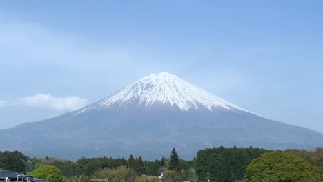 mount fuji, japan’s iconic snowy peak, towering over the landscape in spring