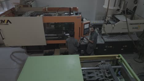 Aerial view of Pakistani workers working at PVC Pipe Making Factory in Karachi, Pakistan.